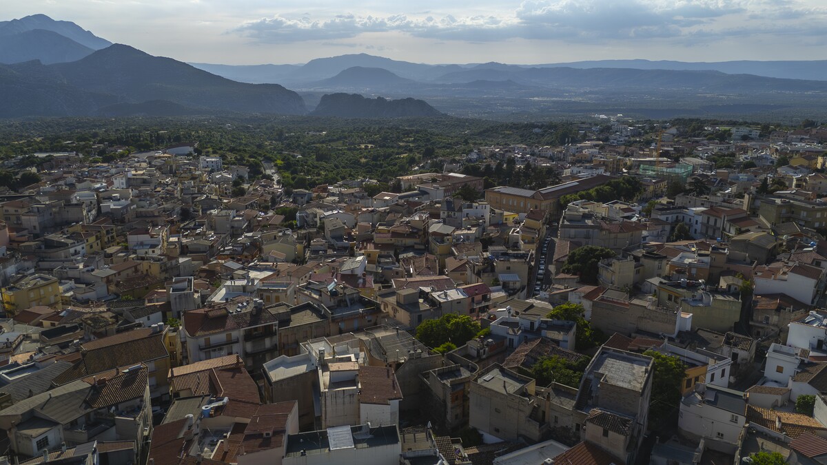 Sunset panorama of Dorgali nestled in the Supramonte valley, gateway to the Gulf of Orosei
